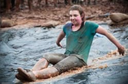 HR Advisor for Devon Air Ambulance, Beth,enjoying herself in a watery mud run challenge