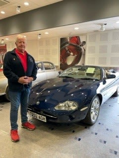 Volunteer Chris Bellworthy with the Jaguar being auctioned for DAA