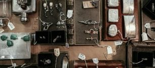 A range of jewellery being priced up for sale