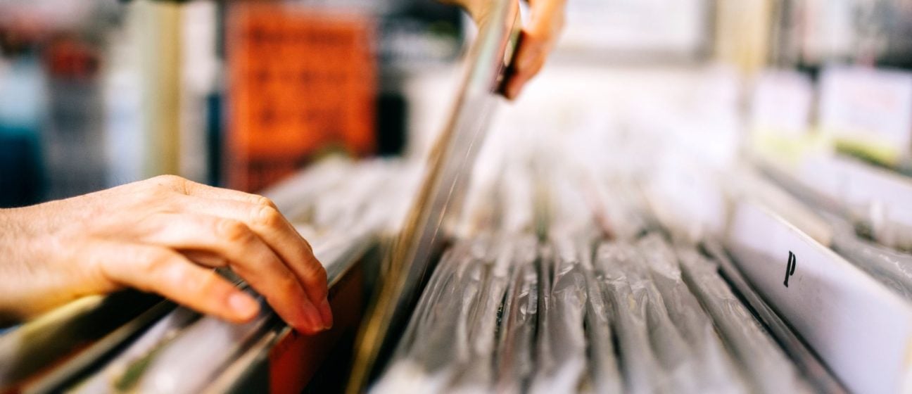 A person sorting through records.