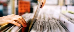 A person sorting through records.