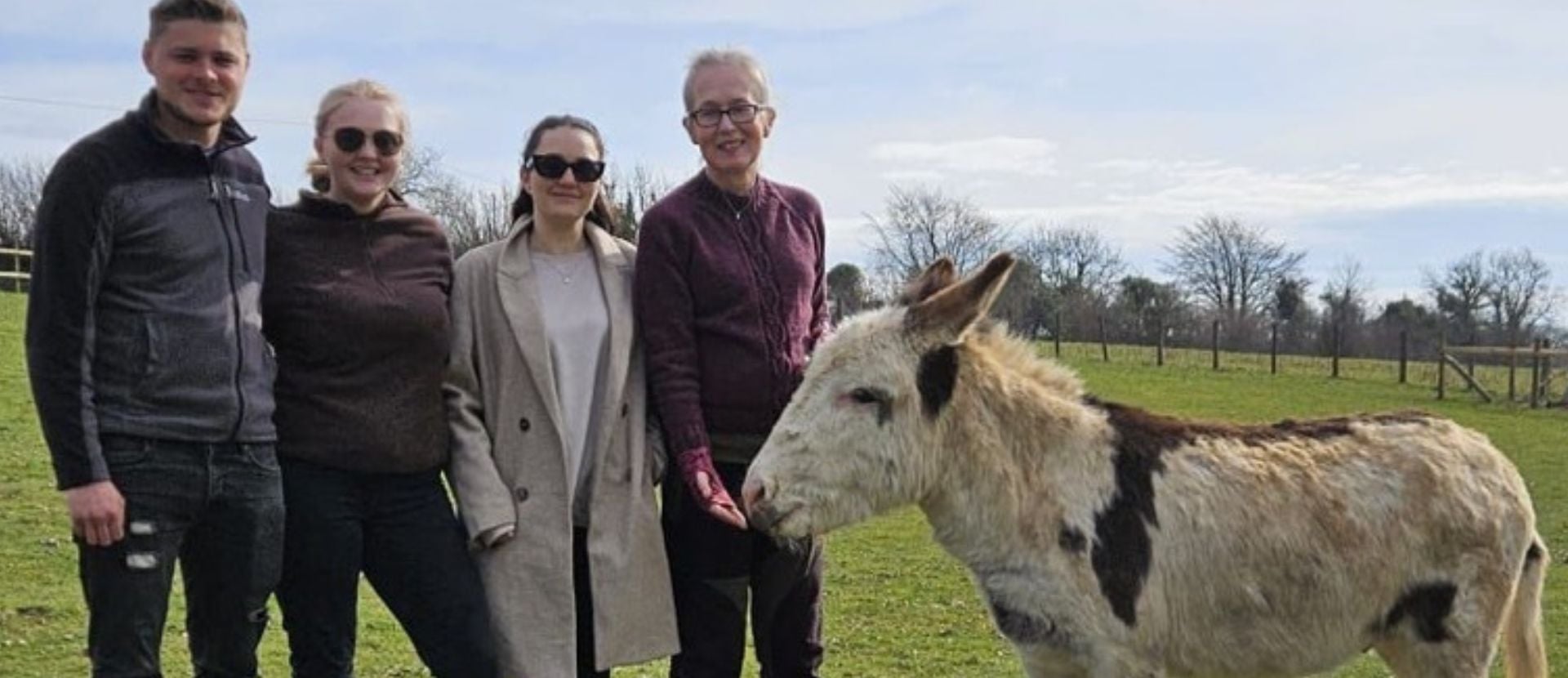Billy, Niamh, Meg and Zoe with Merlin the donkey.