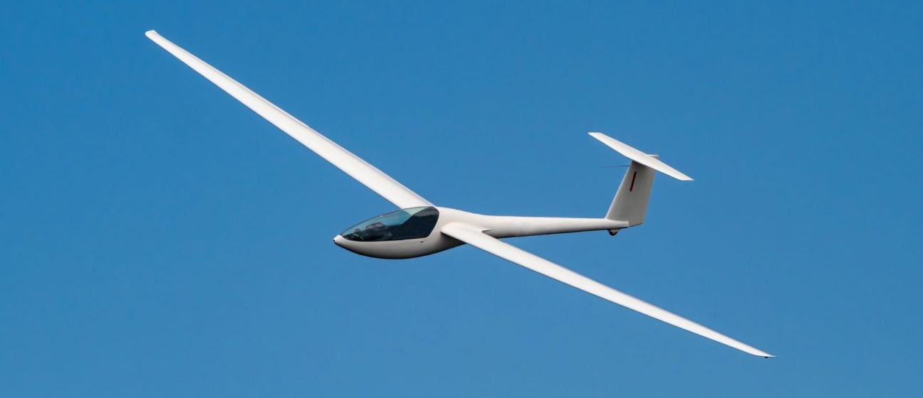 Glider in blue sky