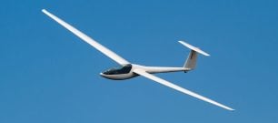 Glider in blue sky
