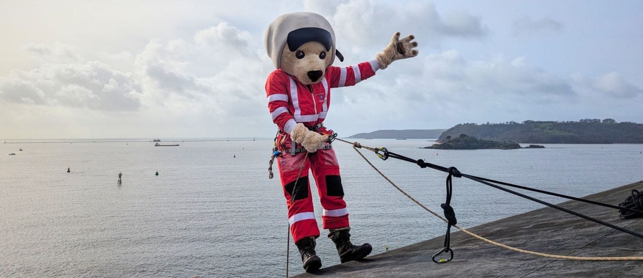 Devon Air Ambulance mascot, Ambrose Bear, abseils the citadel in Plymouth