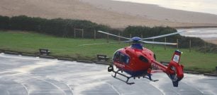 Devon Air Ambulance aircraft in coastal setting