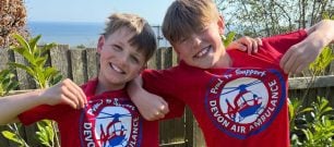 Young fundraisers sporting their Devon Air Ambulance 'proud to support' t-shirt
