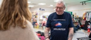 A Devon Air Ambulance volunteer assists in one of our charity shops