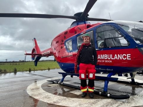 Crew member, Grant, gets festive in on-brand tinsel!