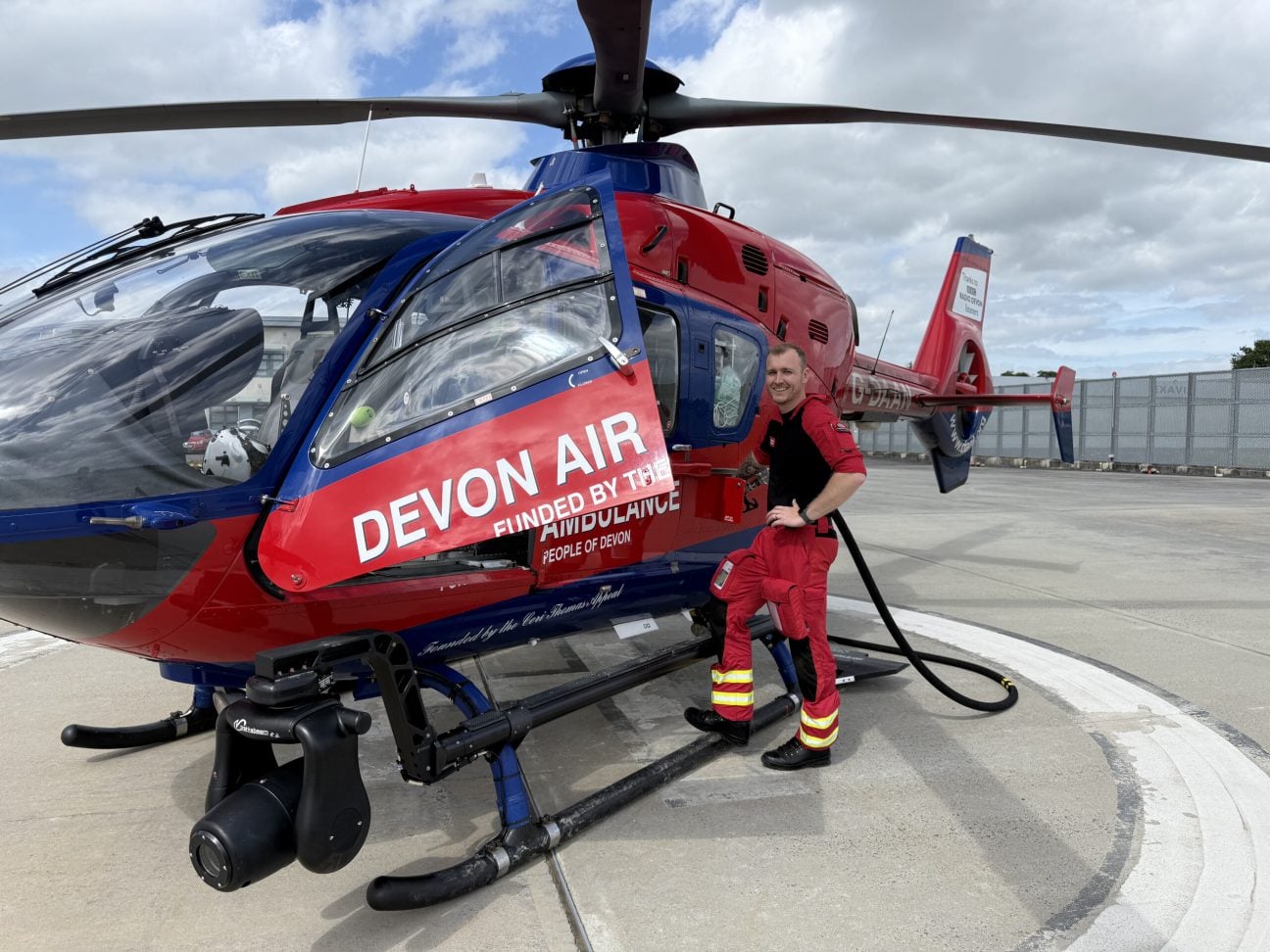 Paramedic, Aaron, tops up the aircraft fuel tank