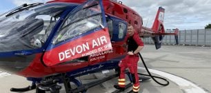 Paramedic, Aaron, tops up the aircraft fuel tank