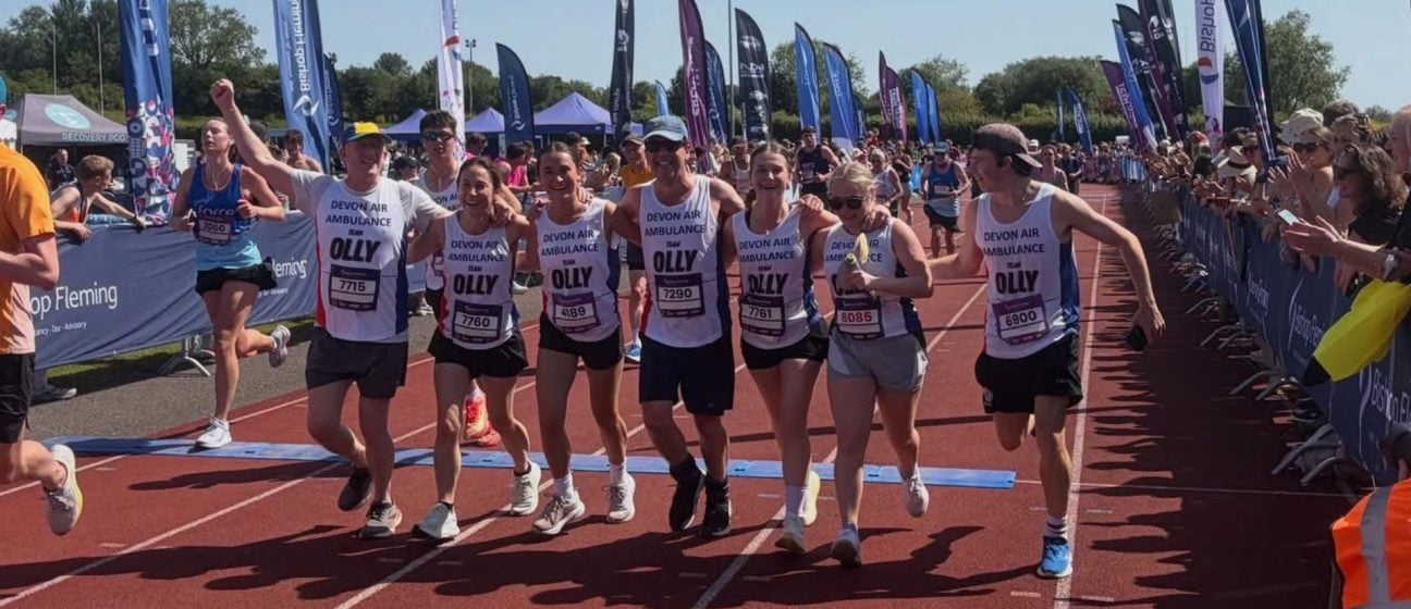 Team Olly celebrates crossing the finishing line