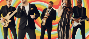 A band singing on a 60s patter backdrop