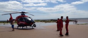 Devon Air Ambulance crew and the aircraft on Sidmouth beach